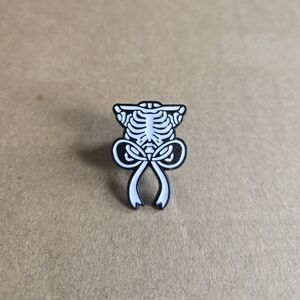 Skeleton Ribcage Bow Enamel Pin